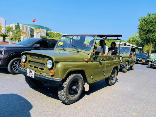 Jeep navigating narrow streets in Hanoi’s historic center
